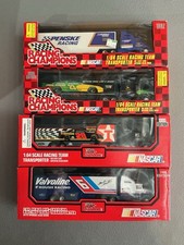 Lot Of 4, Racing Champions 1/64 Transporters. Auction B
