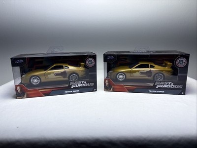 スーパーブランド 5.7 toymod Fast & Furious Lot of 2 Gold Toyota Supra 1:32 Diecast NEW IN BOX