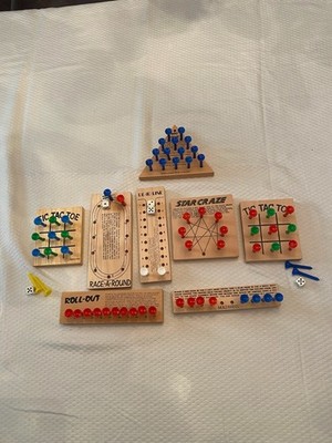 8 small nostalgic wood travel games.  Classic travel game fun.