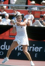 Monica Seles of Yugoslavia hits a return at a women's singles matc- Old Photo 21