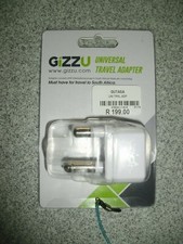 NIP GIZZU UNIVERSAL TRAVEL ADAPTER A MUST FOR TRAVEL TO SOUTH AFRICA NEVER USED.