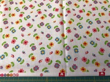 Flowers assorted colors on White 100 cotton fabric sold by the yard 180