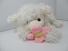 Plush off-white cream lamb sheep pink yellow flower lying down laying shaggy