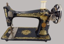 Ancienne machine à coudre SINGER Sphinx Art Déco en fonte fabrication anglaise