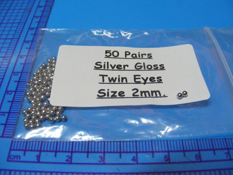 6 paquetes de 50 (300 en total) ojos gemelos de 2 mm en metal plateado brillante para atar moscas Foto 2 de 2