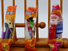 PEZ Witch w/green face & Skull w/purple base + Santa Claus.  New in package