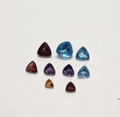 Assorted parcel of Trillion gemstones.  9 stones. WP26-2