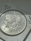 1889 MORGAN SILVER $1AU