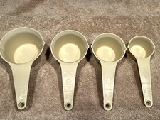 Vintage Foley Almond Measuring Cups Set Of Four 1/8 - 1/2 Cup Made In The USA