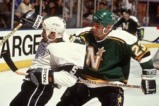 Brian Bellows Minnesota North Stars comes up behind Tim Watters Lo- Old Photo