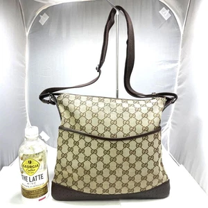Sac bandoulière Gucci motif GG toile cuir poinçonné marron GUCCI #PGGXVV