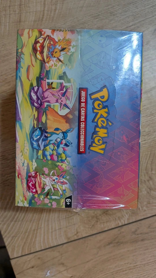 Prismatic Evolutions SEALED Mini Tin Display Box Full Set of 8 Tins - SPANISH - Image 4 of 4