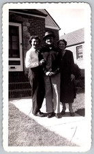 Vtg B&W Snapshot Three People Man Hat Women Outside Brick House 1940s