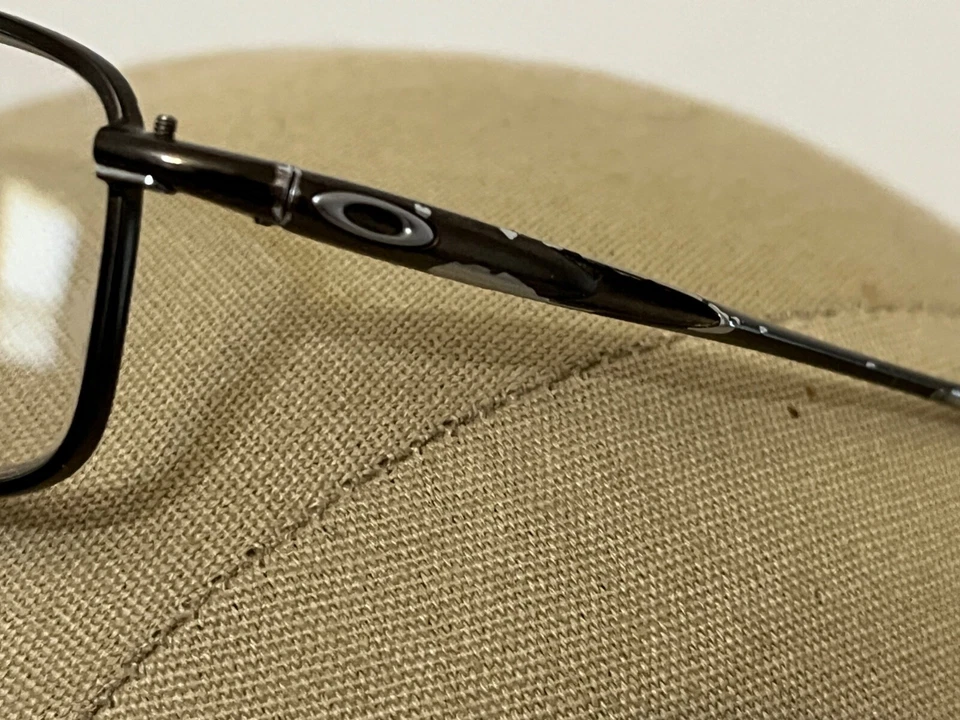 Óculos Oakley Casing OX3110-0354 armação cromada 54-18-143 - Imagem 4 de 4