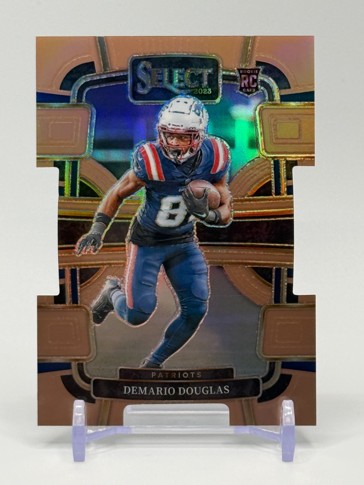 2023 Panini Select Demario Douglas Concourse Bronze Prizm Die-Cut /299 #68