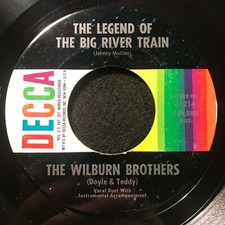 The Flame's Still Burning +1 by The Wilburn Brothers (Decca 31214) 7