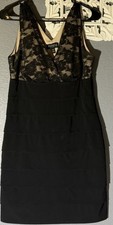 Enfocus Studio black cocktail dress with lace top and a fitted mini silhouette
