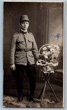 Romania Postcard Romanian Soldier Taking Picture with Flowers 1924 RPPC Photo