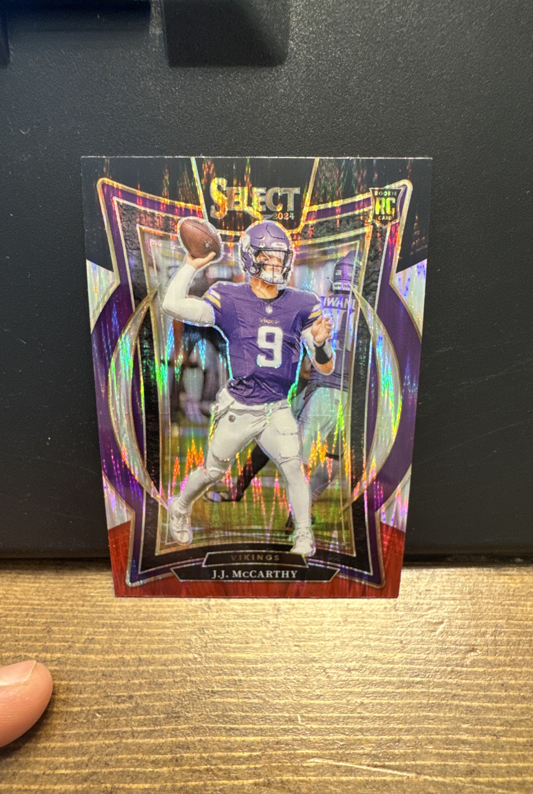 2024 Panini Select - Concourse J.J. McCarthy #24 Black & Red Shock Prizm (RC)