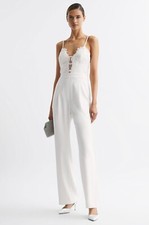 REISS CORA LACE PLUNGE NECK JUMPSUIT in IVORY