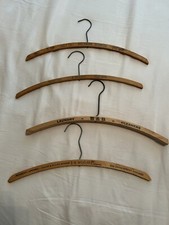 4 vintage wooden advertising clothes hangers: IL-CA-LA/AR-NC