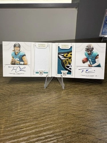 2021 Panini Nat’l Treas. Dual Patch Auto /10 Trevor Lawrence and Travis Etienne