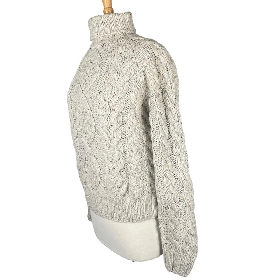 Suéter de pescador tejido con cable para mujer grande cuello alto avena moteado tejido acogedor Foto 4 de 4