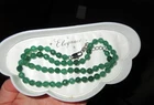 Beautiful 6.5mm knotted faceted green adventurine necklace
