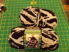 Two skeins Bernat Super Stripes yarn B & W black white
