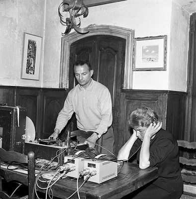 Simone Signoret listening to the recording of one interview for th- Old Photo