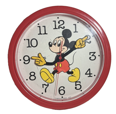 Vintage, working, battery operated Mickey Mouse clock. Made in