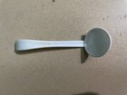 Used plastic coffee spoons