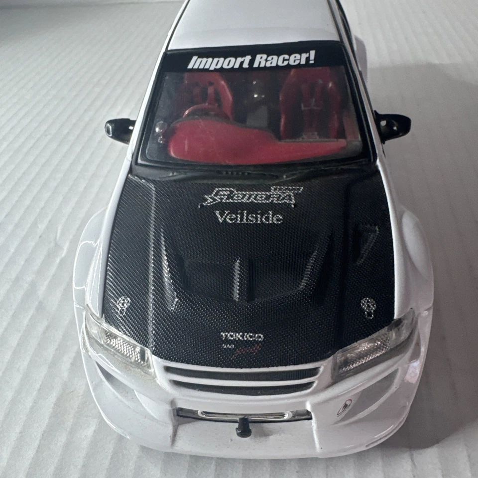 ИМПОРТНЫЙ ГОНОЧНЫЙ АВТОМОБИЛЬ MITSUBISHI LANCER EVOLUTION VI 6 1:24 БЕЛЫЙ - Изображение 3 из 4