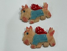 Two old Occupied Japan celluloid Scottie dog pins