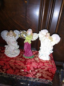 Three Little Angels That Could Be Added To A Nativity Scene In The Background