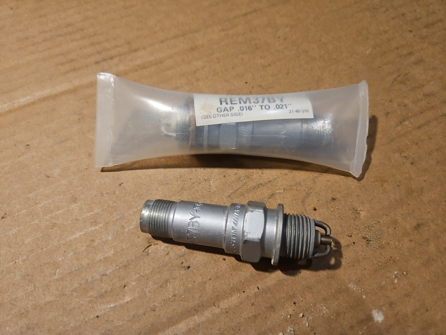 Pair Of Champion REM37BY Spark Plugs- 1 New, 1 Used