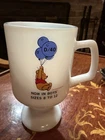 New ListingVintage Winnie the Pooh milk glass pedestal mug with promotional text.