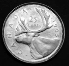 1965 25¢ silver coin in a paper flip