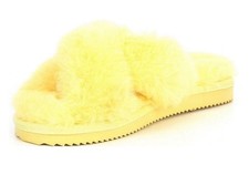 Michael Kors Lala slippers feature a vibrant yellow faux fur cross-band upper