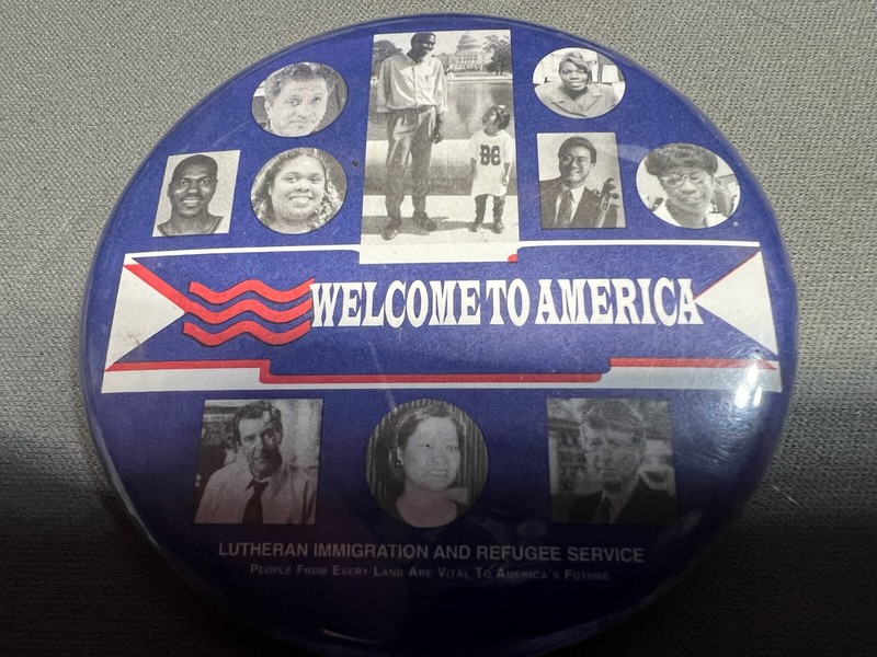 WELCOME TO AMERICA BUTTON