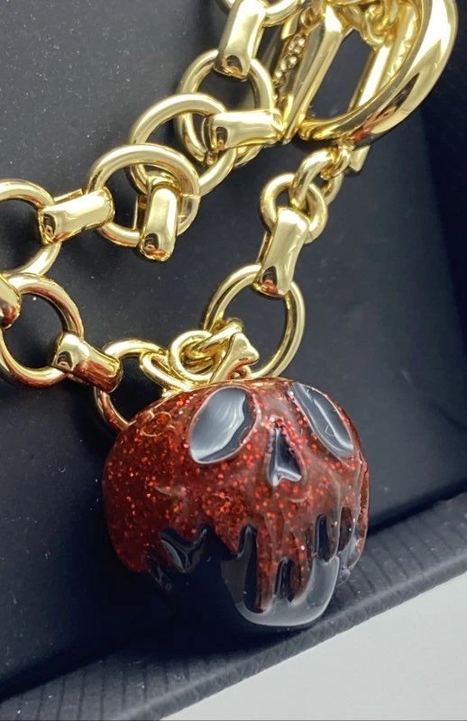 Pulsera Disney X Coach Tono Dorado Veneno Manzana Dije Palanca con Caja 12.9g Foto 2 de 4