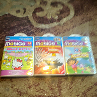 VTech MobiGo Learning Game Lot 3: Hello Kitty, Kung Fu Panda 2, Dora Twins' Day