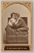 Vintage 1910 Romantic Couple in Trunk Postcard 'A Cozy Corner Built for Two'