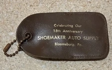 Vintage SHOEMAKER AUTO SUPPLY 15TH ANNIV PARKING COINS Keychain CLOSED PA