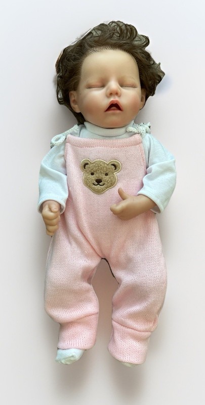 Lifelike Sleeping Baby With Pink Sweater Coveralls Curly Hair