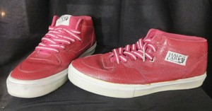 red high top vans on feet