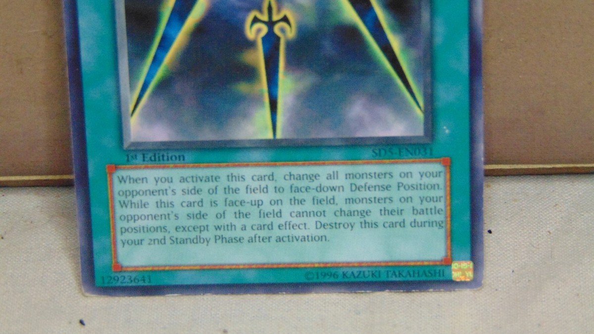 1996 YU'GI-OH! 1 ST EDITION SWORDS OF CONCEALING LIGHT SPELL CARD