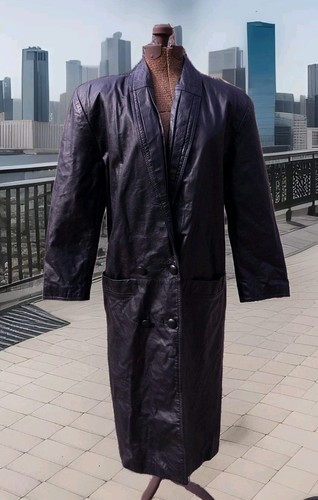 Black vintage leather trench coat with wide shoulder pads, double-breasted buttons, and notched collar on mannequin.