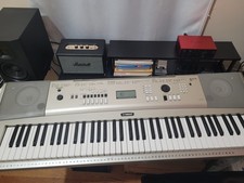 Yamaha YPG-235 76-Key Electronic Keyboard With Power Adapter And music rest