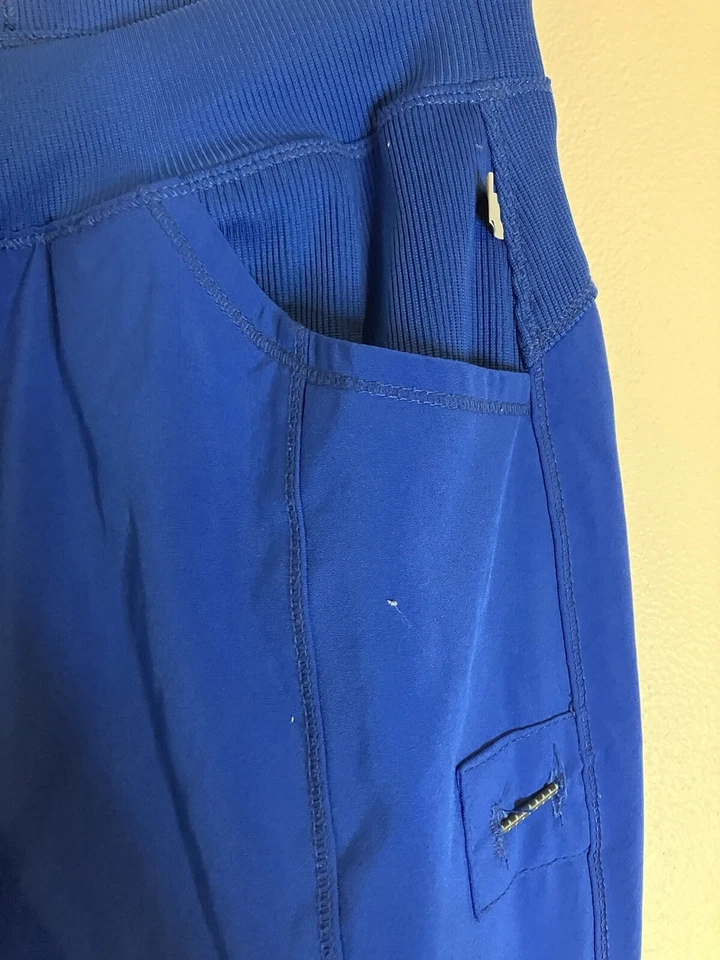 Exfoliantes de cuidado azul real uniforme médico parte inferior pequeña alta Foto 4 de 4